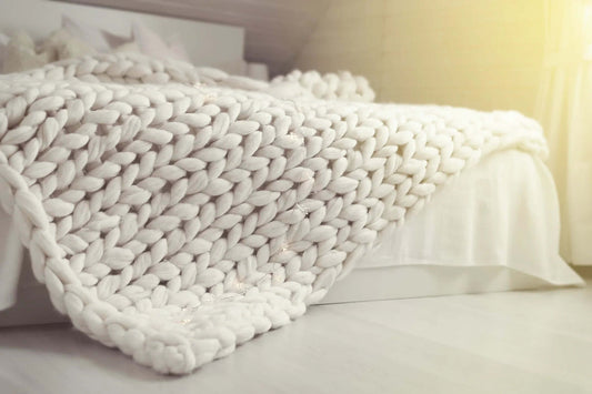 Chunky knit blush weighted blanket made of breathable cotton for deep sleep and anxiety relief-White