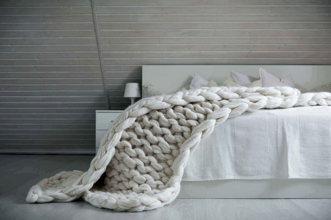 White Chunky knit weighted blanket on the bed