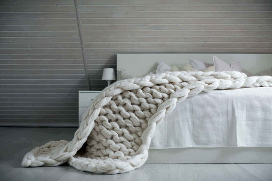 White Chunky knit weighted blanket on the bed