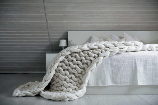 White Chunky knit weighted blanket on the bed
