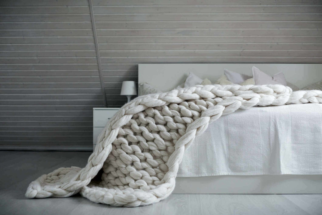 White Chunky knit weighted blanket on the bed