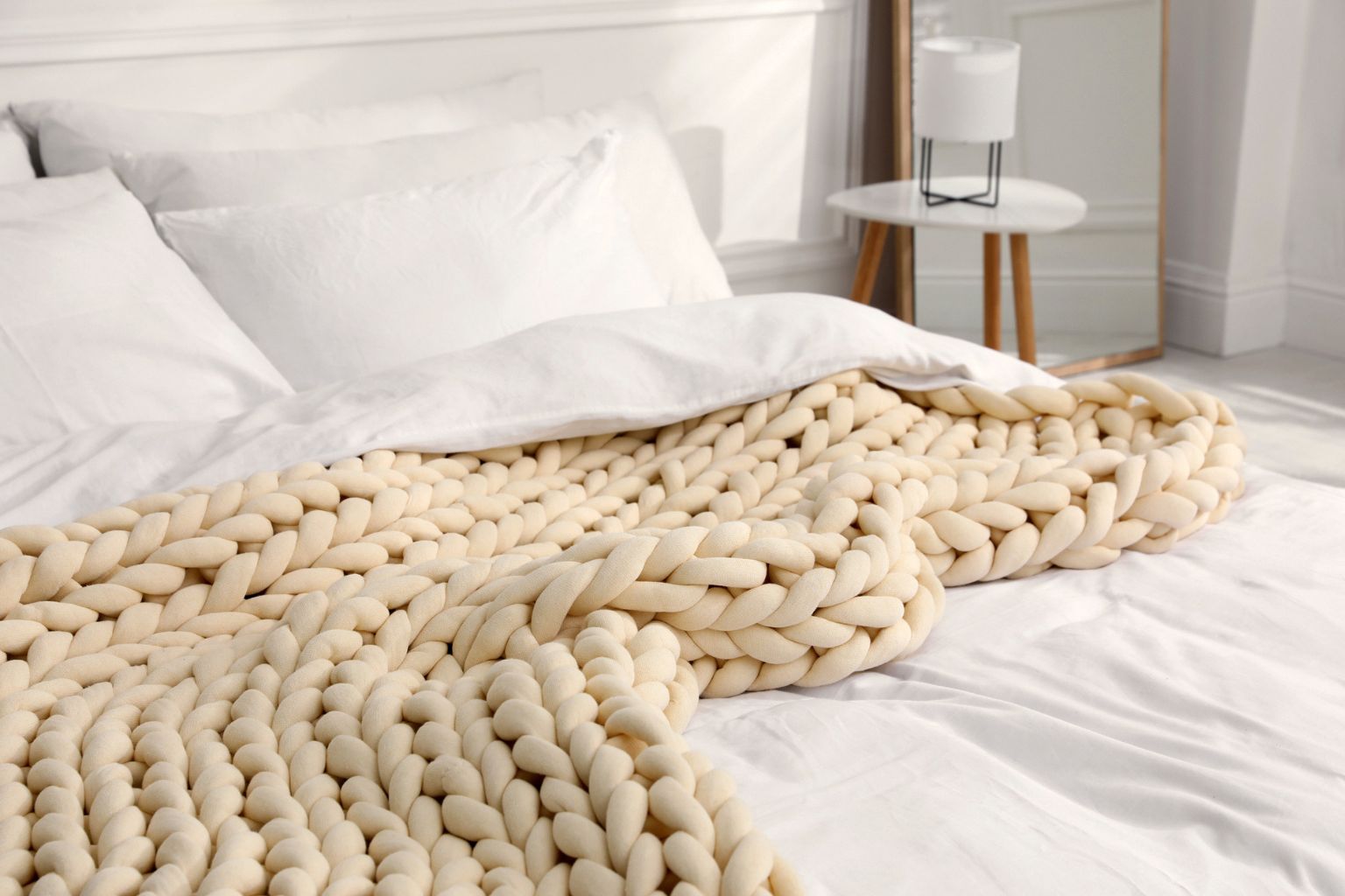 Bloomknit warm sand chunky cooling cotton weighted blanket on the bed