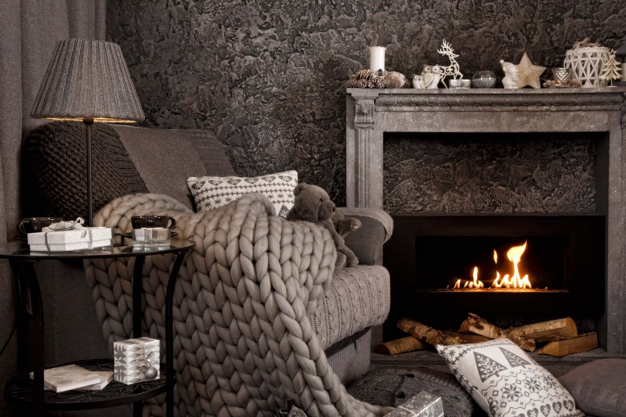 Luxurious open-loop BloomKnit™ weighted blanket draped on an armchair